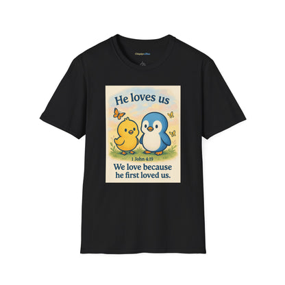 Christian T-Shirt "He Loves Us" Cute Penguin & Chick — 1 John 4:19 Faith Tee
