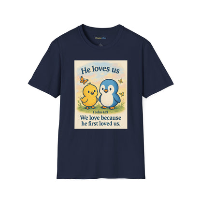 Christian T-Shirt "He Loves Us" Cute Penguin & Chick — 1 John 4:19 Faith Tee